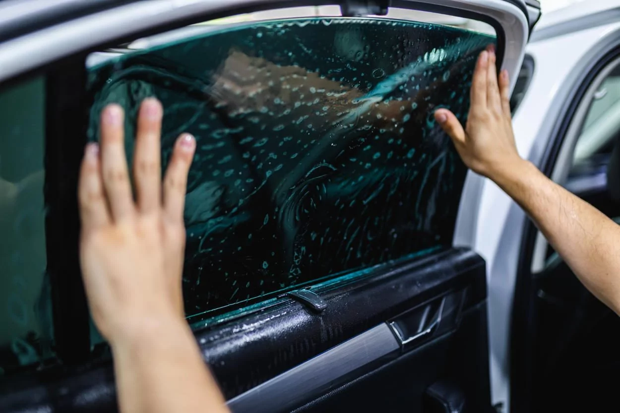 A car with professionally installed window tinting for UV protection in Dubai